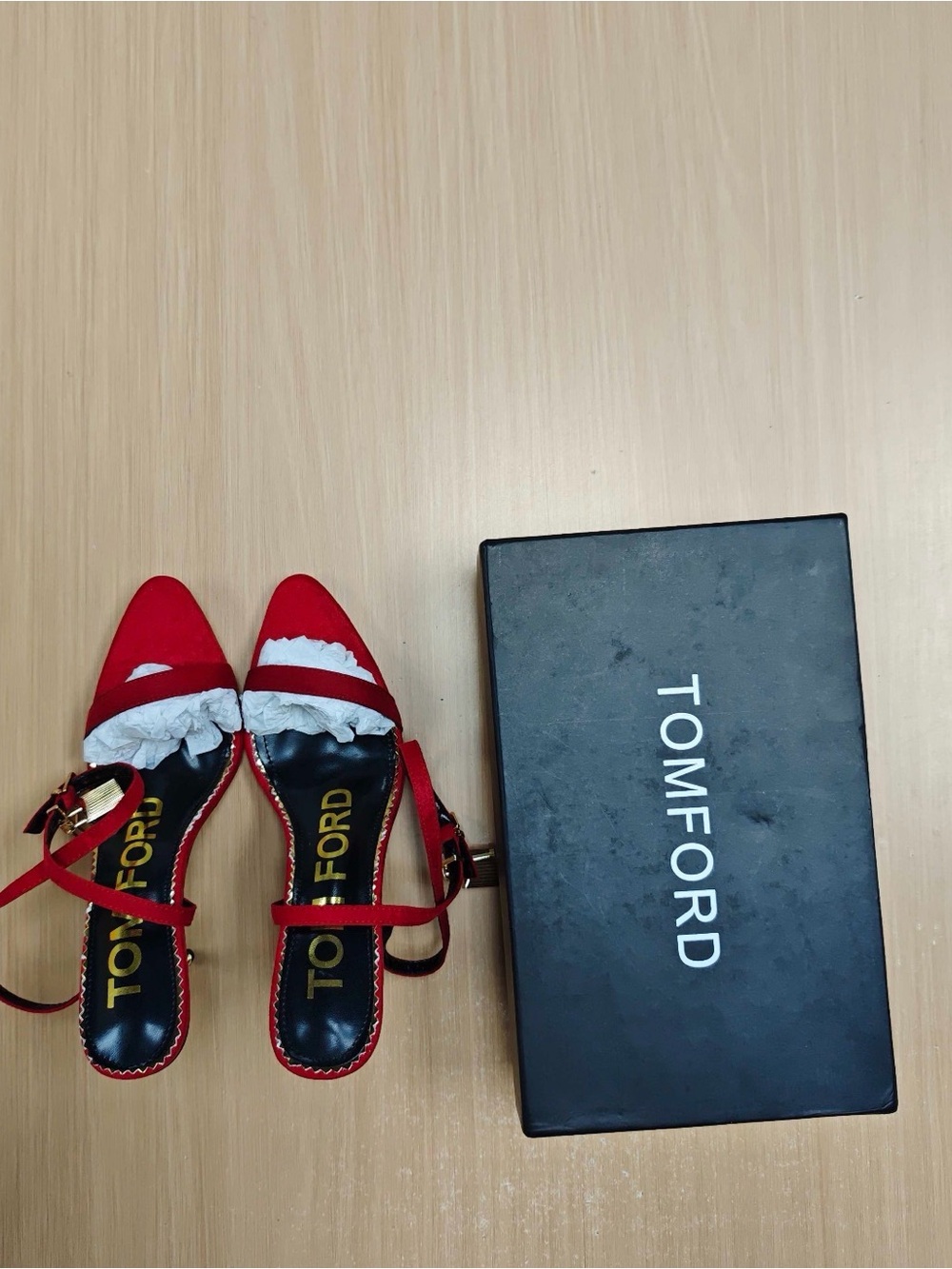 Red Pointed-Toe Slingback Heels with Gold Buckles.